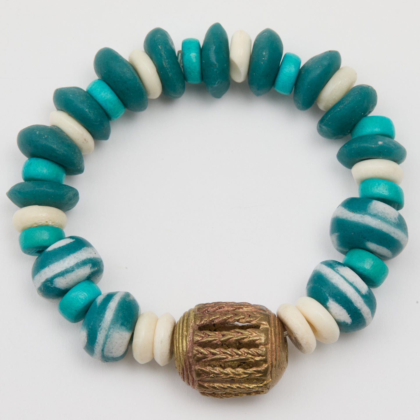 Bracelet with blue, white, and brown beads on a white background