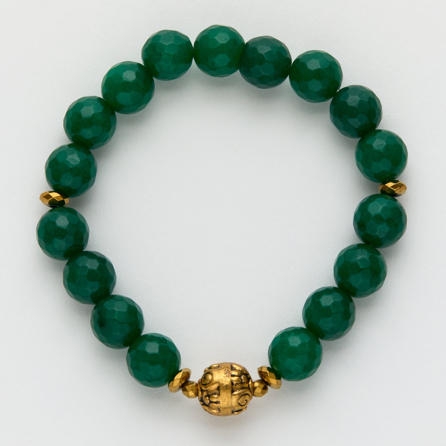 Green beaded bracelet with a gold clasp on a white background