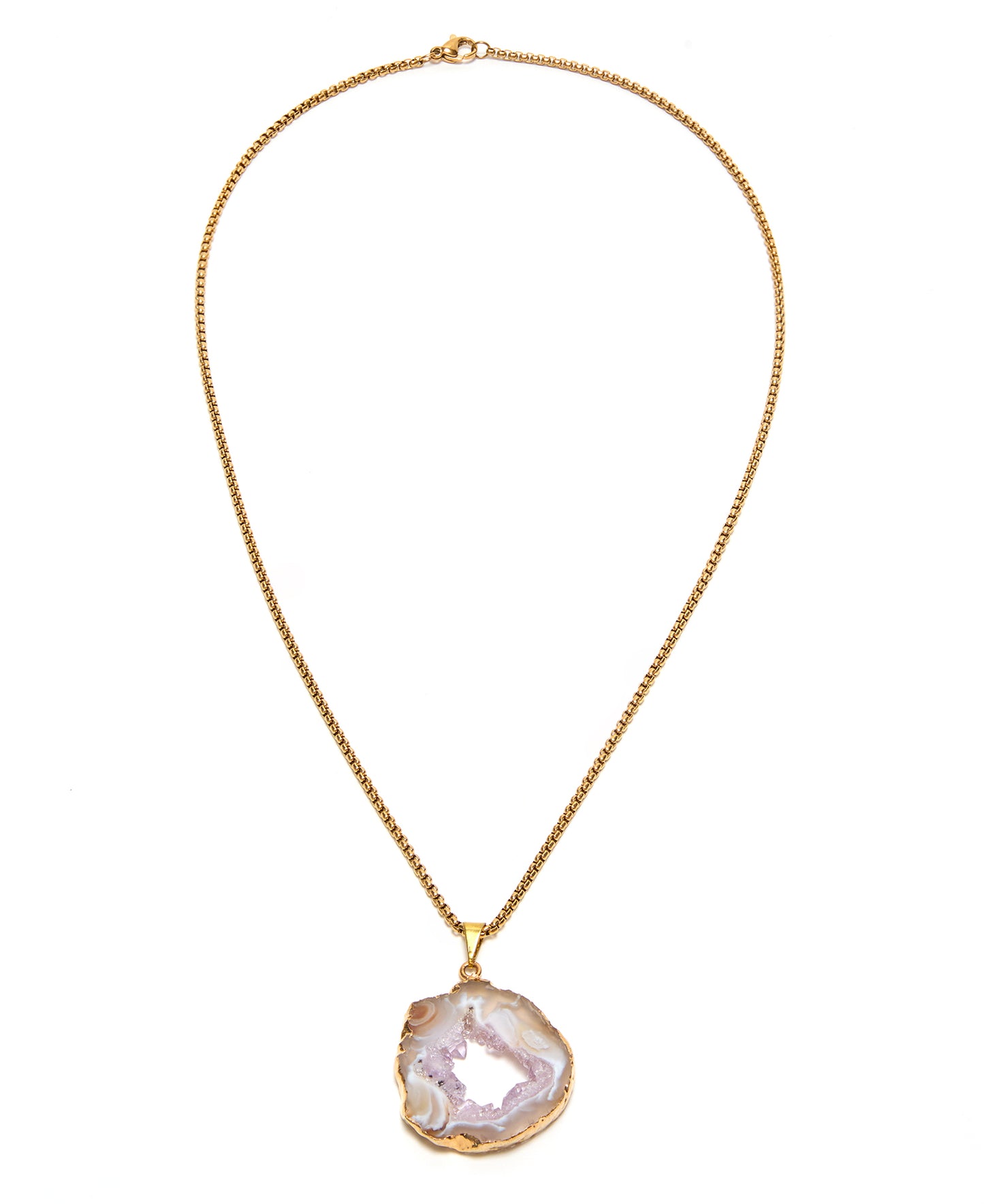 Gold necklace with a large oco agate pendant on a white background