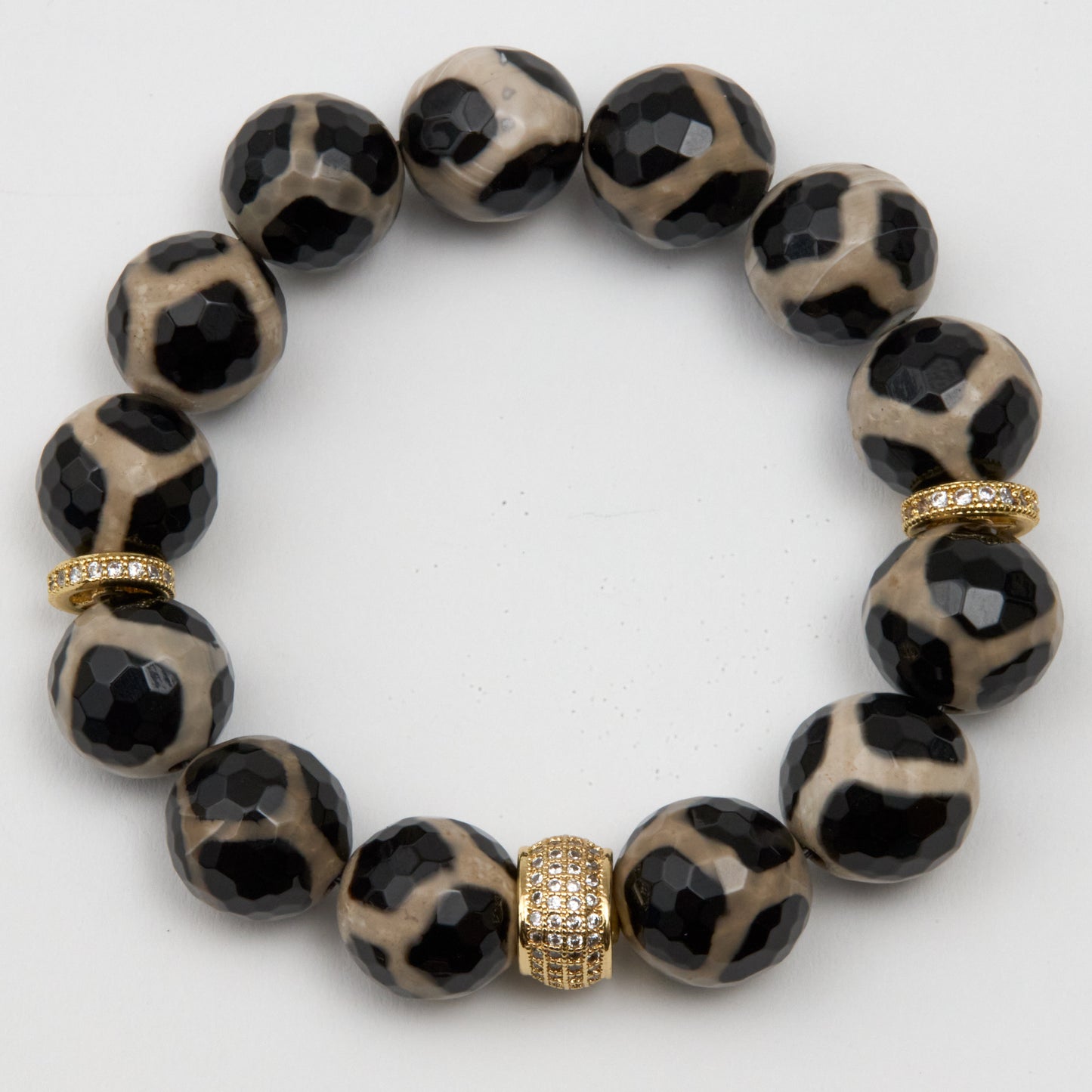 Leopard print beaded bracelet with gold accents on a white background