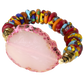 Colorful beaded bracelet with a pink stone on a white background