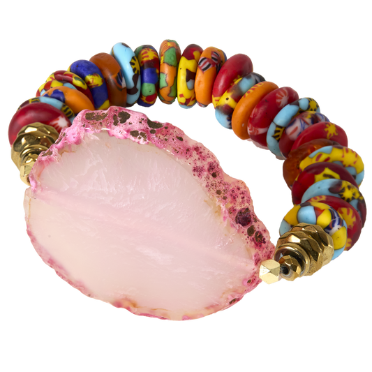 Colorful beaded bracelet with a pink stone on a white background