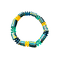 A beaded stretch bracelet featuring painted turquoise, dark blue, and yellow-green beads, accented with bright yellow and translucent teal spacers, shown on a plain white background.