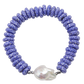 Blue beaded bracelet with a large white pearl on a white background