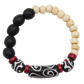 Bracelet with black, white, and red beads on a white background