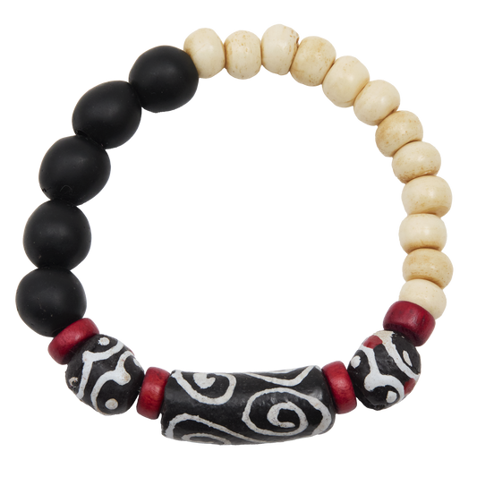 Bracelet with black, white, and red beads on a white background