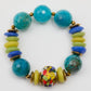 Colorful beaded bracelet with turquoise, yellow, and multicolored beads on a white background