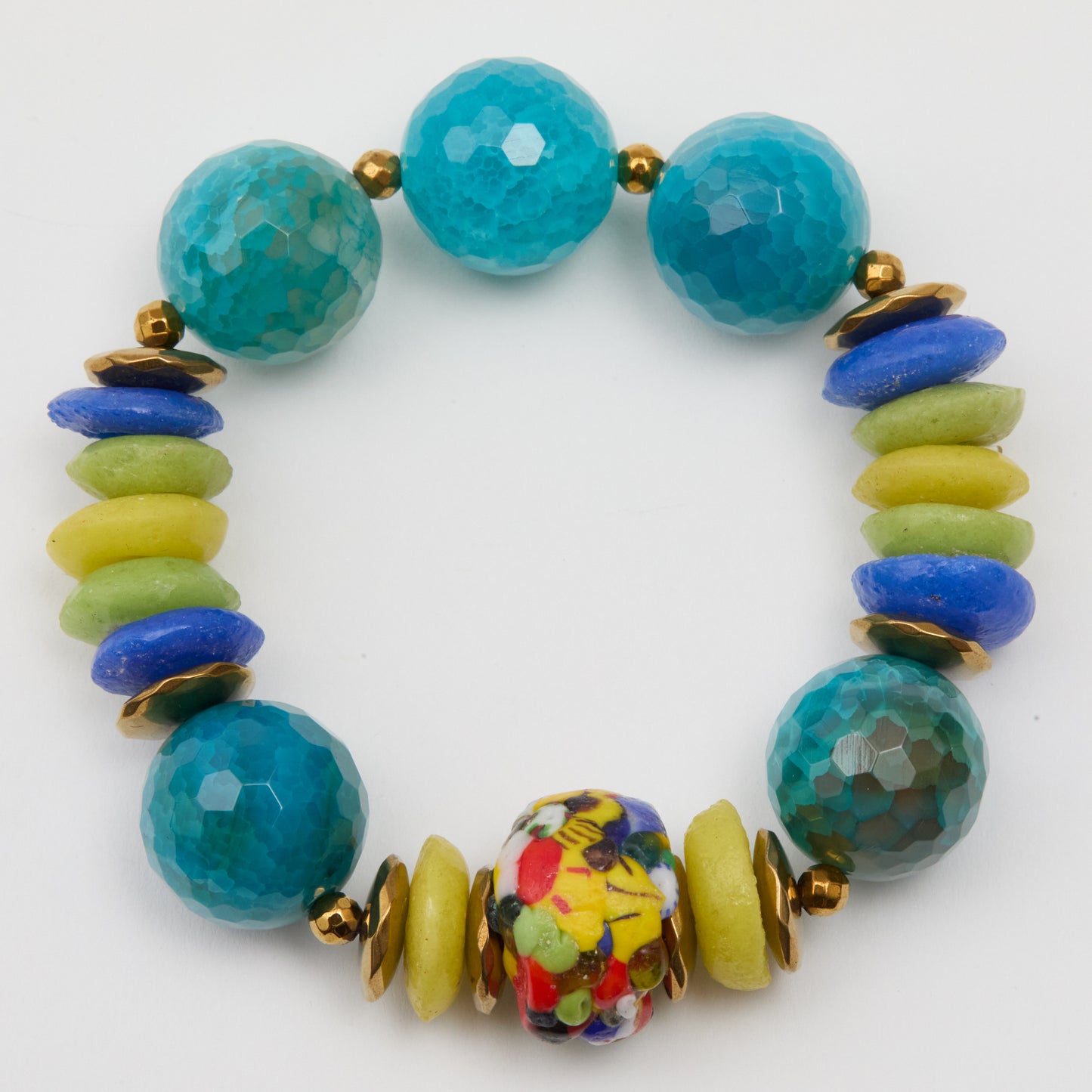 Colorful beaded bracelet with turquoise, yellow, and multicolored beads on a white background