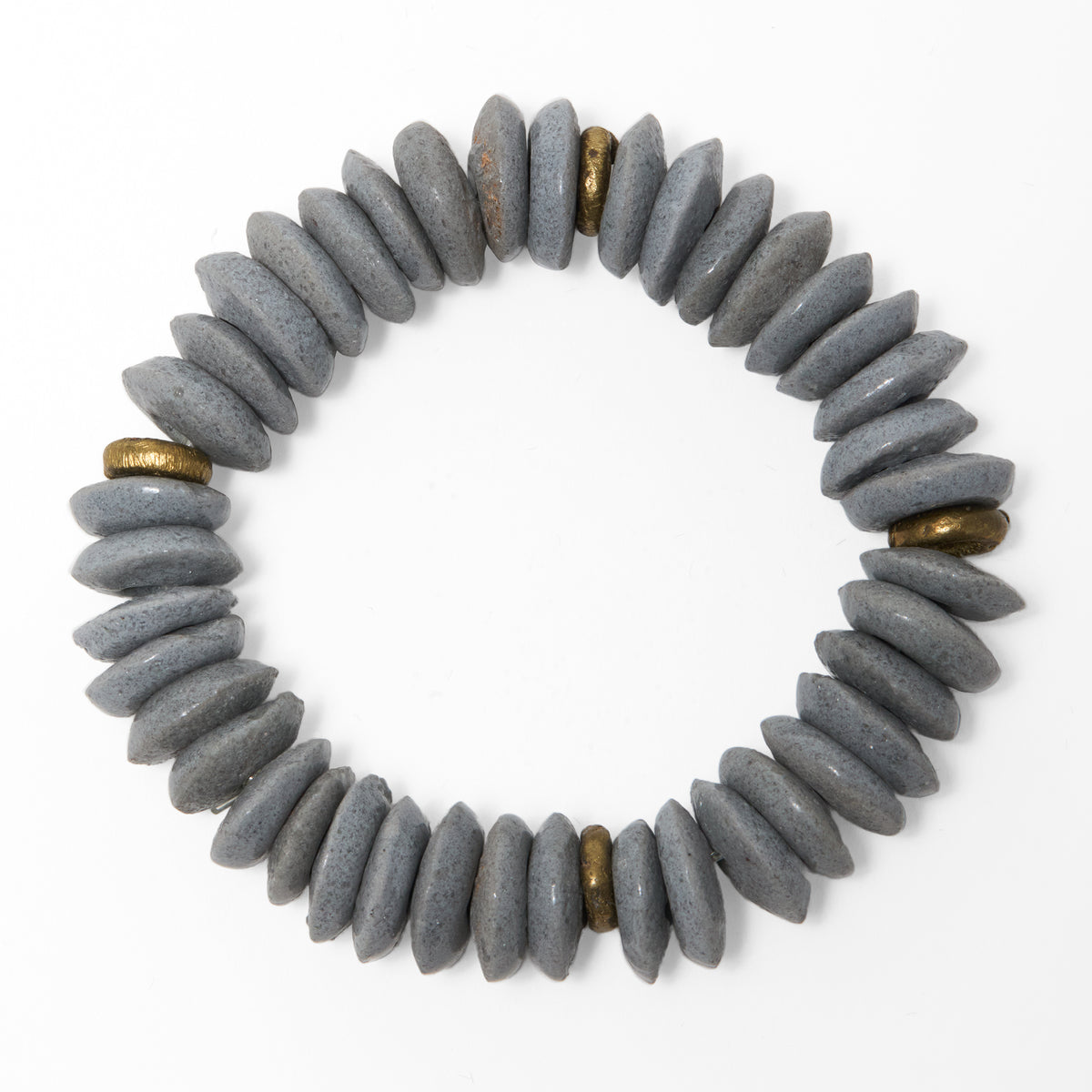 A circular beaded bracelet made of grey Ashanti beads with brass spacer beads, shown on a plain white background.