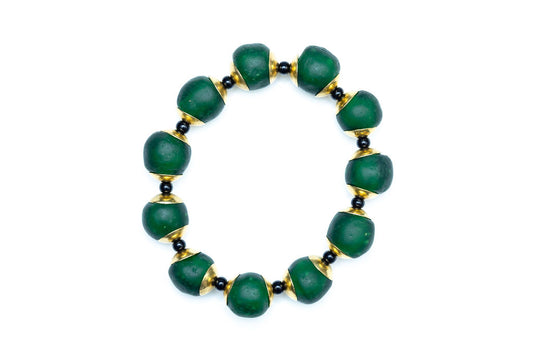 Hunter green bracelet with brass and black accent beads against white background