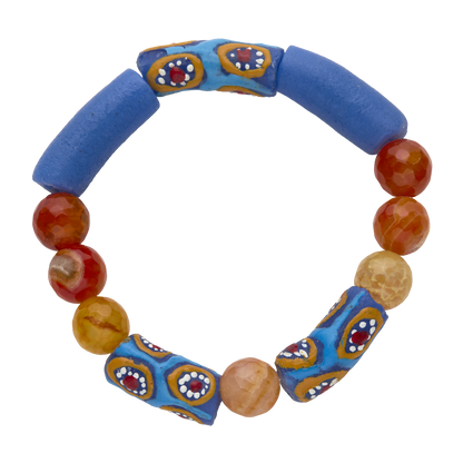 Colorful beaded bracelet with blue fabric clasps on a white background