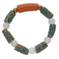 Bracelet with patterned beads and a large orange bead on a white background