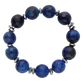Blue beaded bracelet with silver accents on a white background