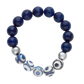 Bracelet with blue beads and silver and white patterned beads on a white background