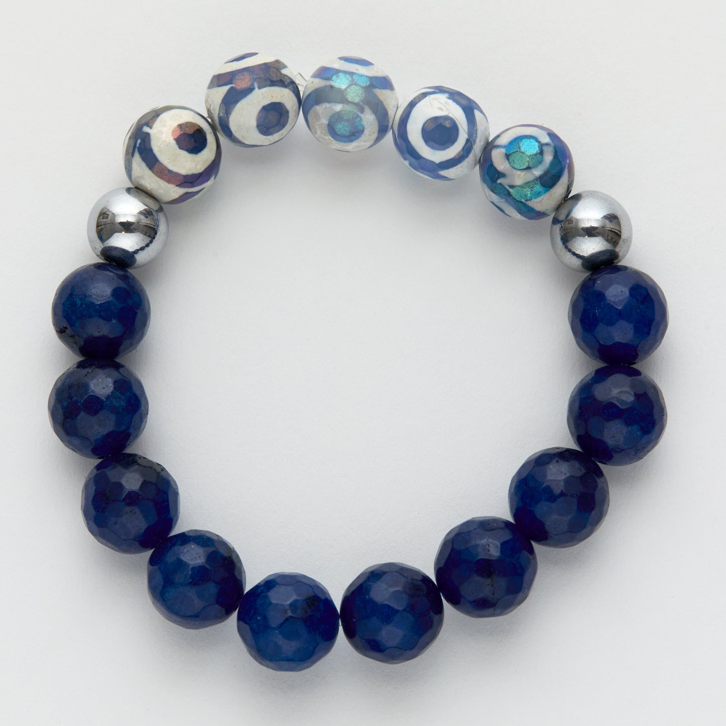 Beaded bracelet with blue beads and silver accents on a white background