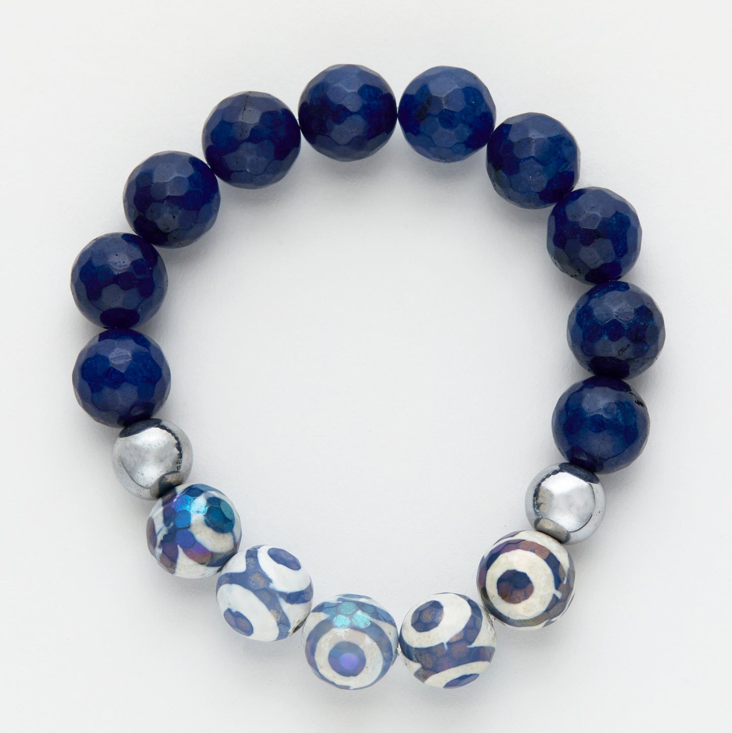 Navy blue beaded bracelet with silver and patterned beads on a white background