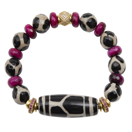 Bracelet with black and white patterned beads and gold accents on a white background