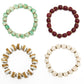 Four beaded bracelets in different colors on a white background