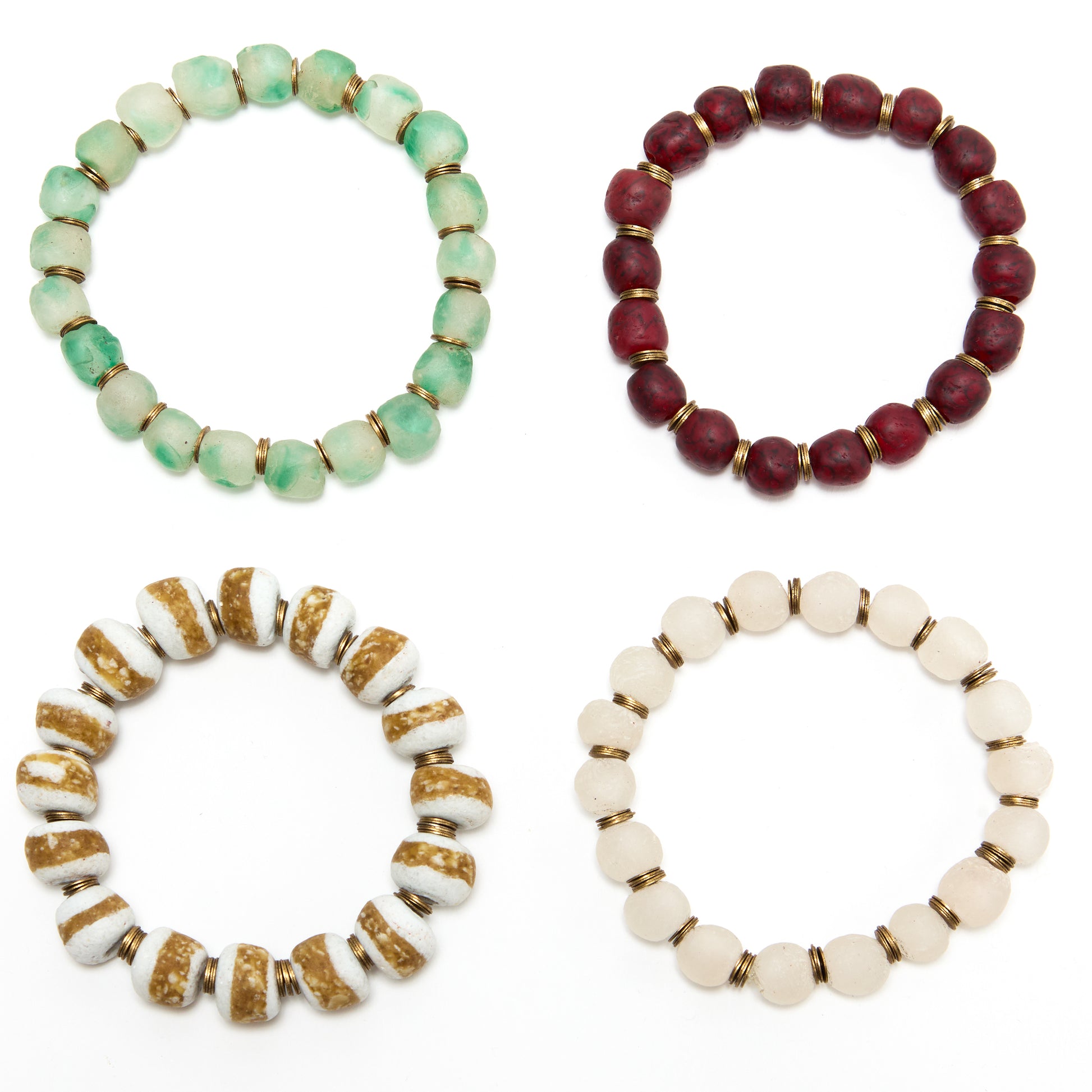 Four beaded bracelets in different colors on a white background