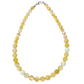 Necklace with yellow and white marbled beads on a white background