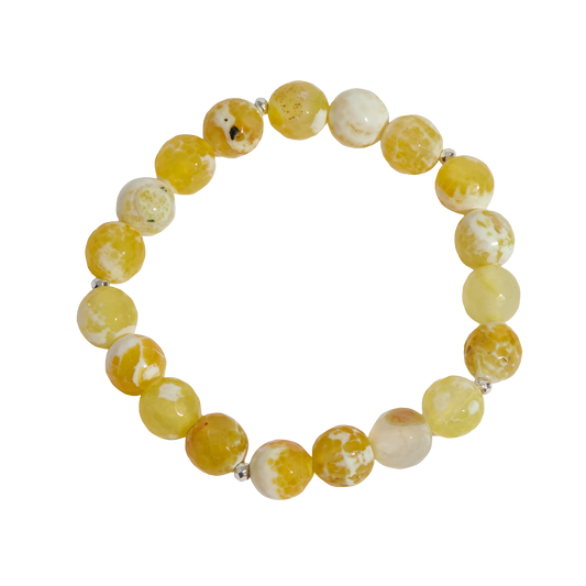 Yellow and white marbled bead bracelet on a white background