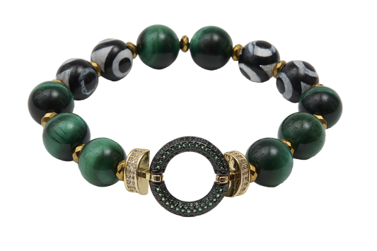 Green beaded bracelet with gold and black accents on a white background