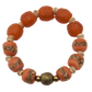 Bracelet with orange beads and gold accents on a white background