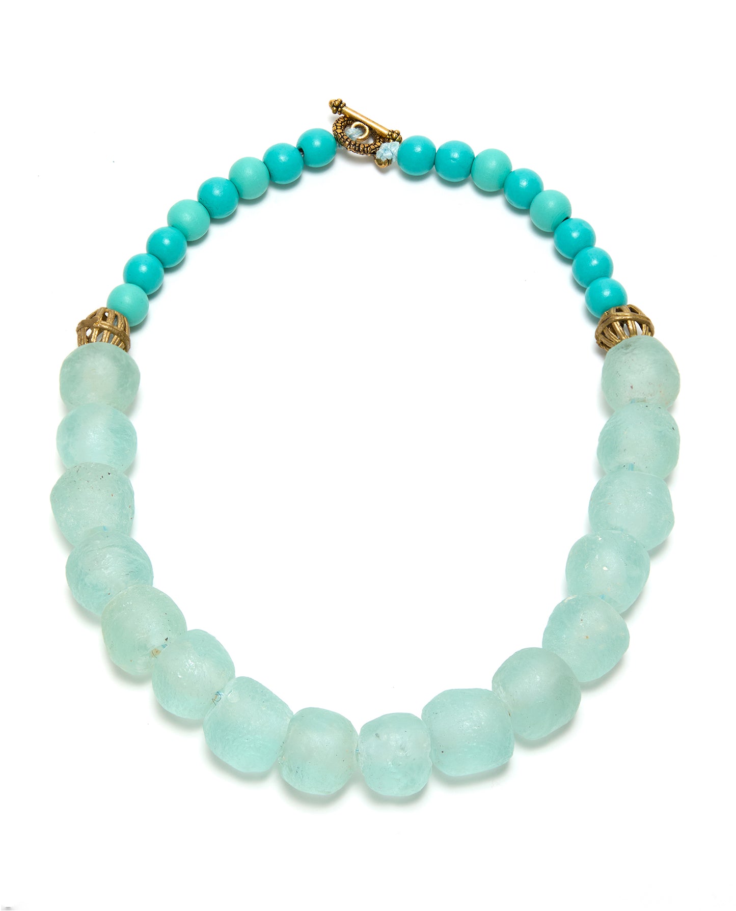 Turquoise and gold beaded necklace on a white background
