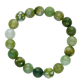Green and white beaded bracelet on a white background