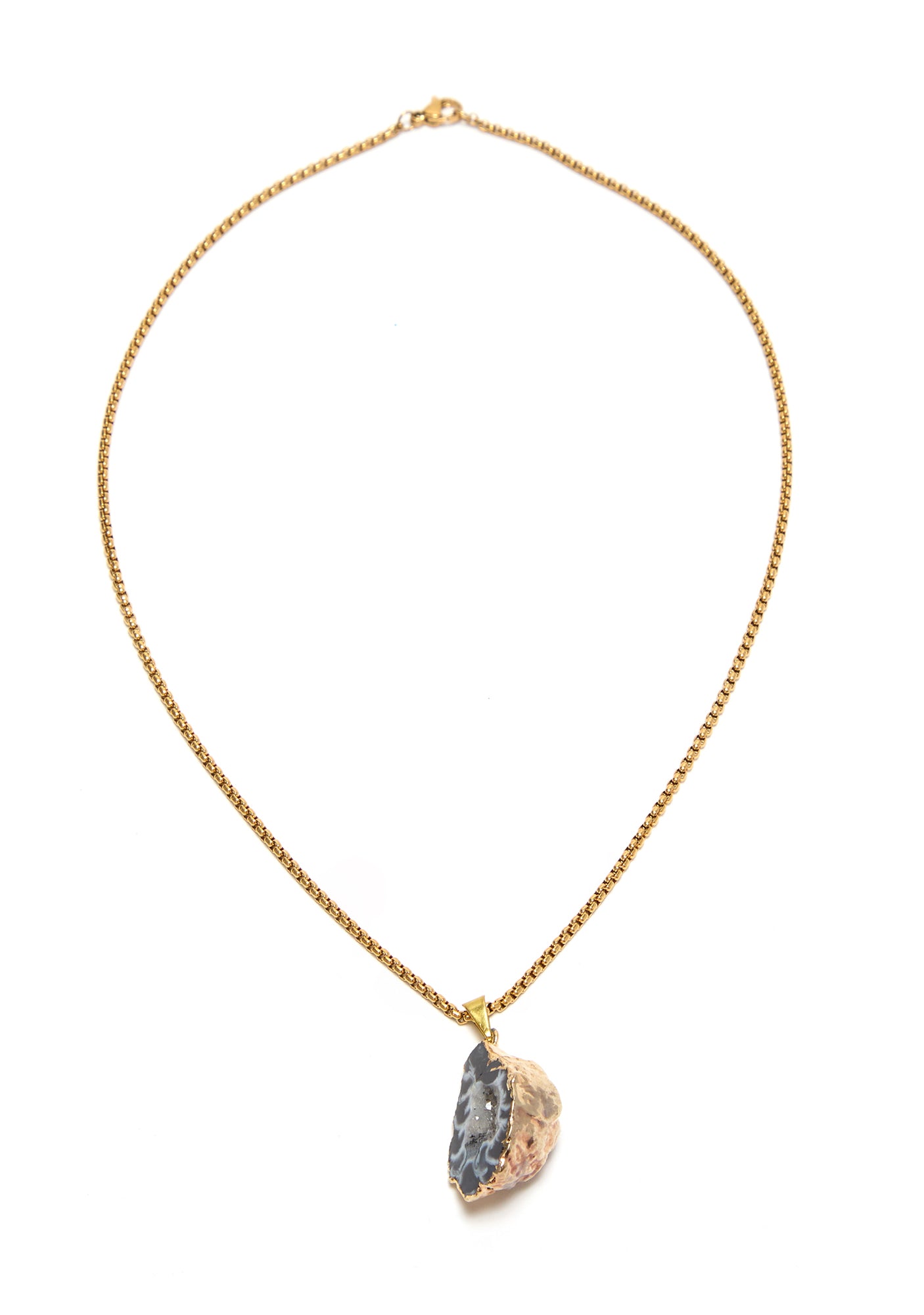 Gold necklace with a unique pendant on a white background