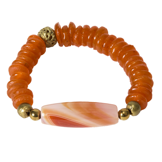 Bracelet with orange beads and an orange and white stone on a white background