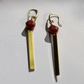 A pair of gold-tone brass earrings with red creek jasper faceted beads.