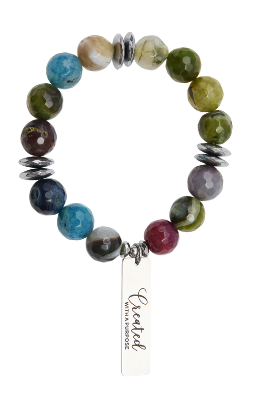 Multicolored beaded bracelet with a tag on a white background