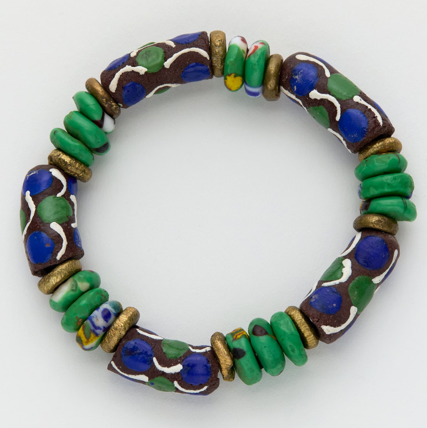 Colorful beaded bracelet with green, blue, and gold beads on a white background