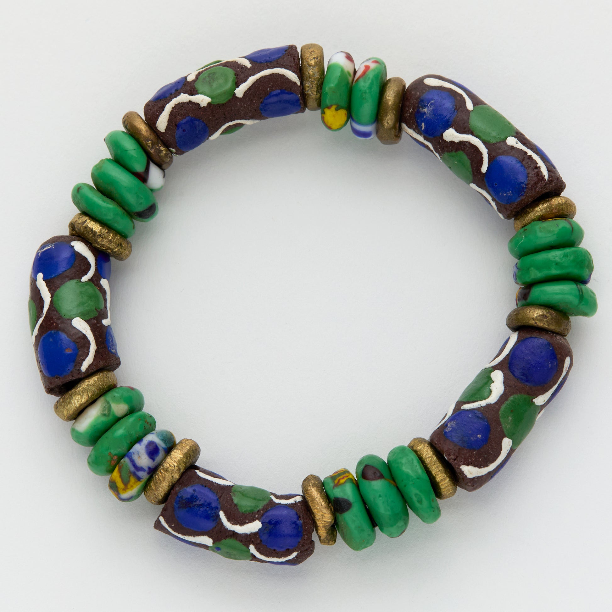 Colorful beaded bracelet with green, blue, and gold beads on a white background