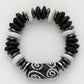 Black and white beaded bracelet on a white background