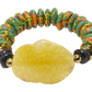 Colorful beaded bracelet with a large yellow stone on a white background