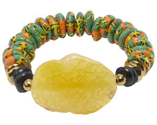 Colorful beaded bracelet with a large yellow stone on a white background