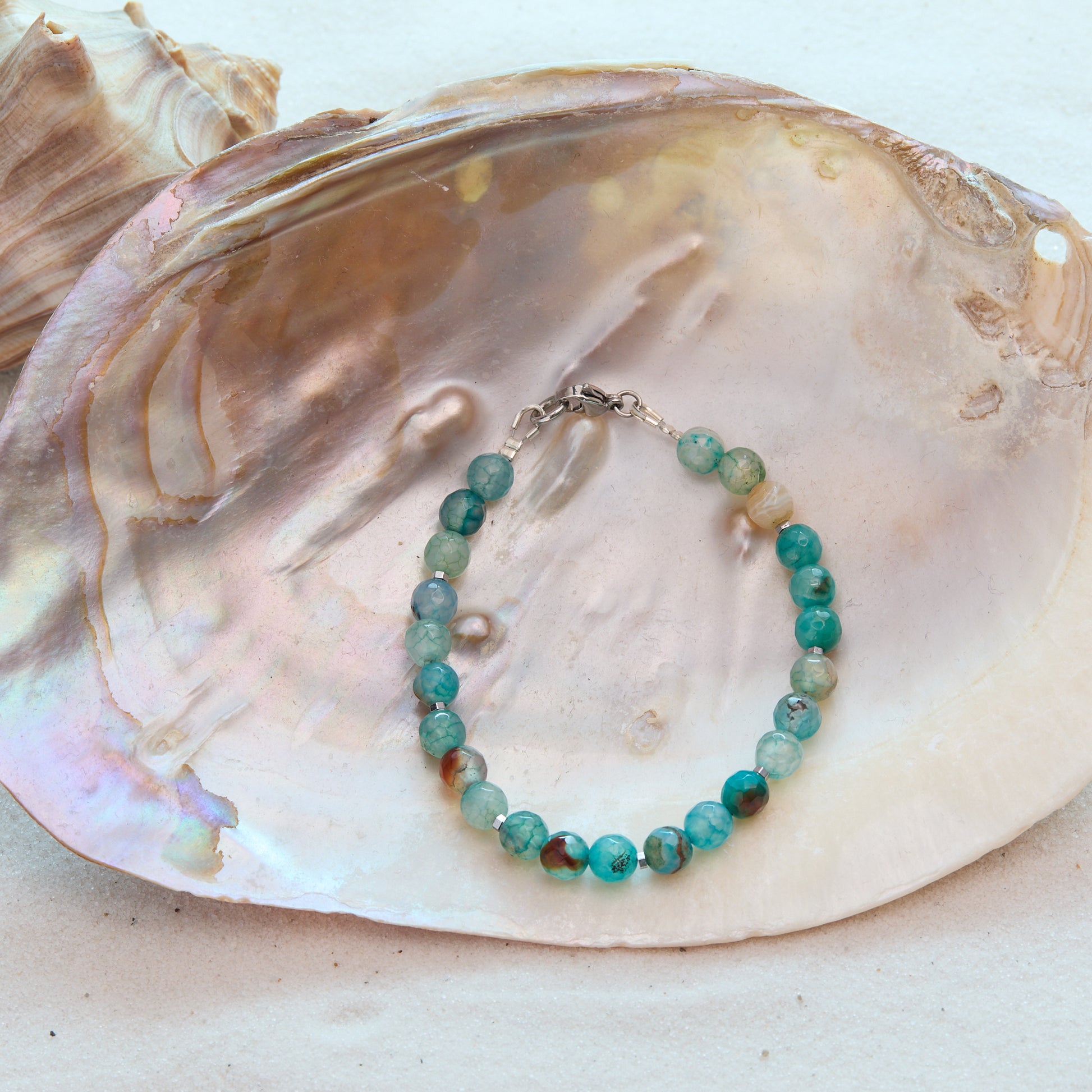 Turquoise beaded bracelet on a large shell