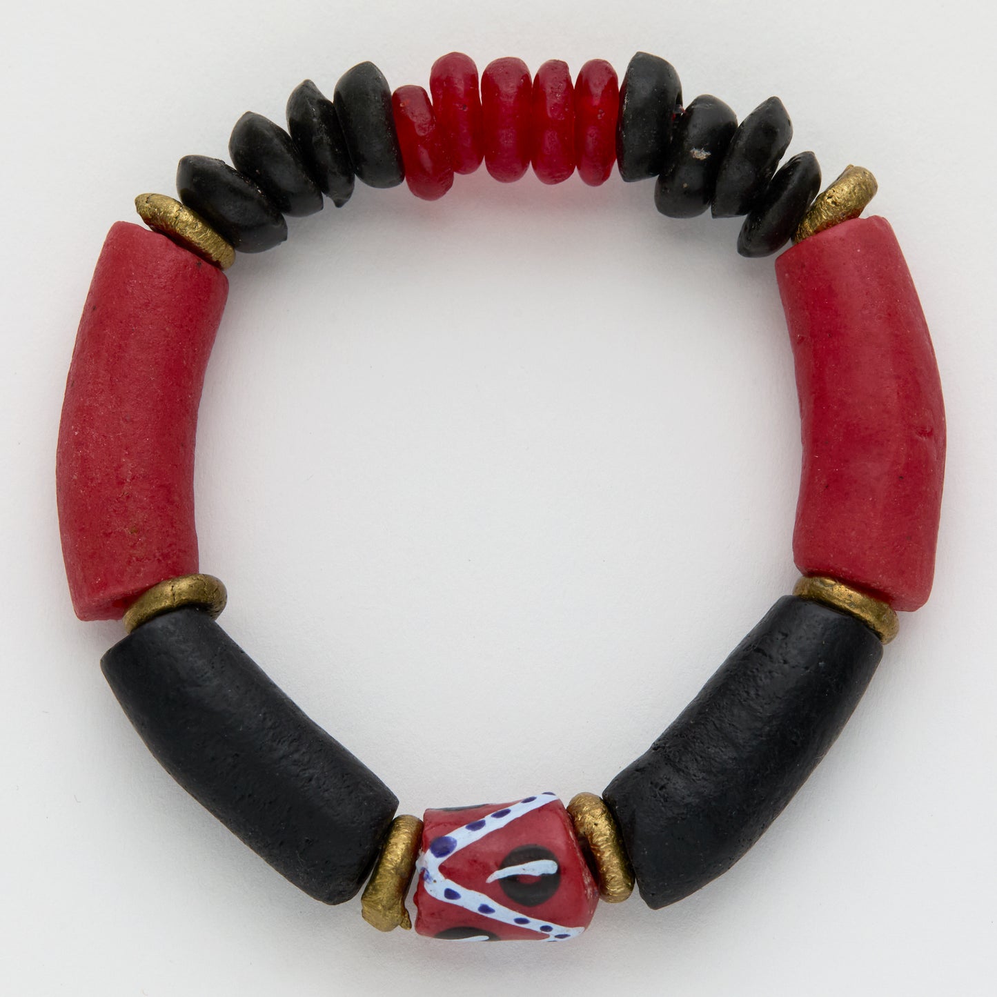 Bracelet with red and black beads on a white background