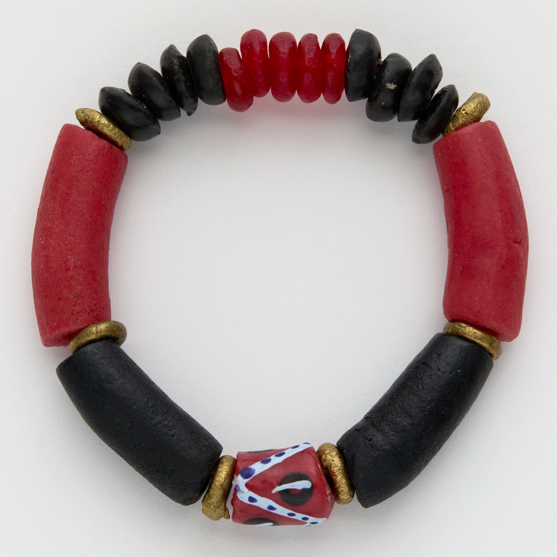 Bracelet with red and black beads on a white background
