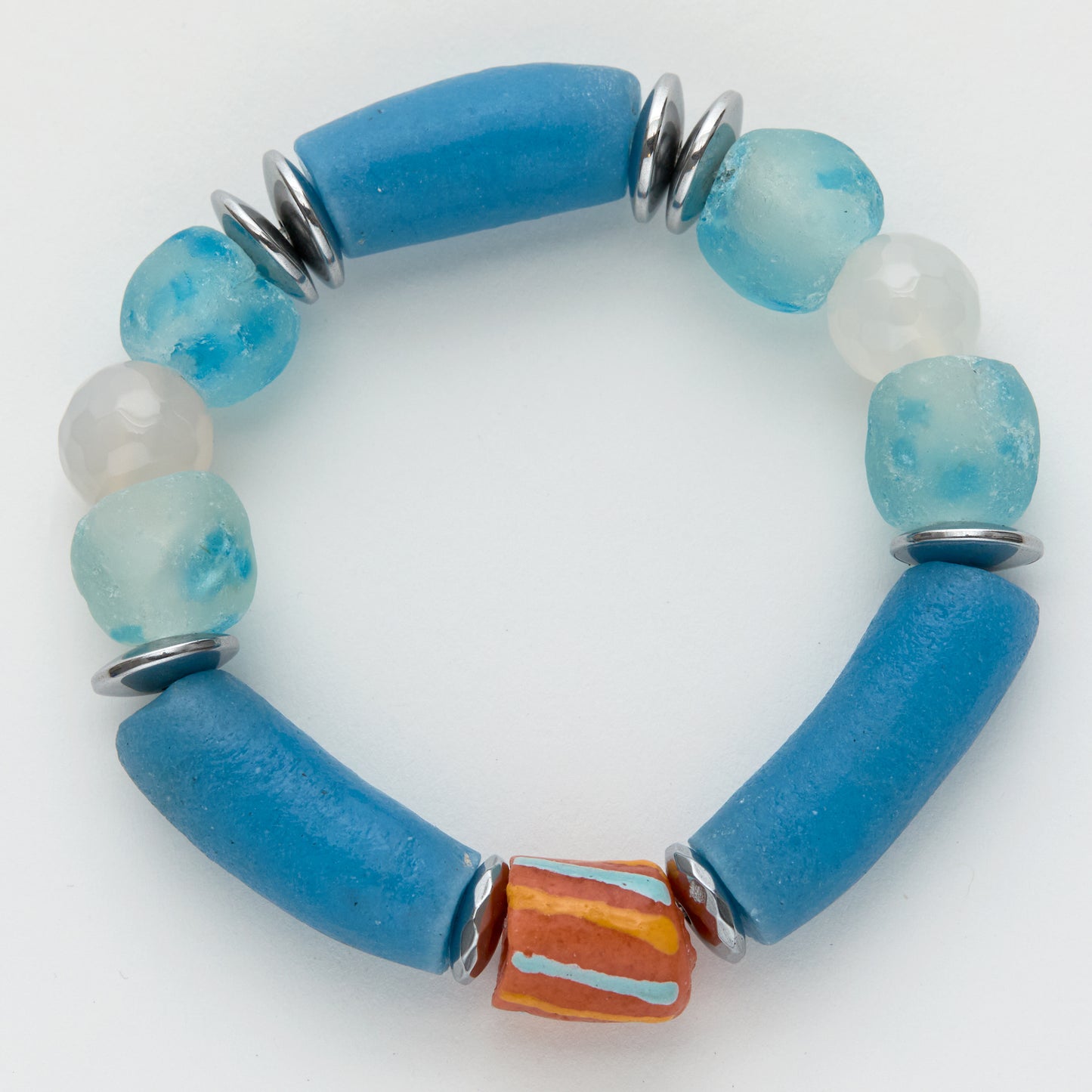 Blue and white beaded bracelet on a white background