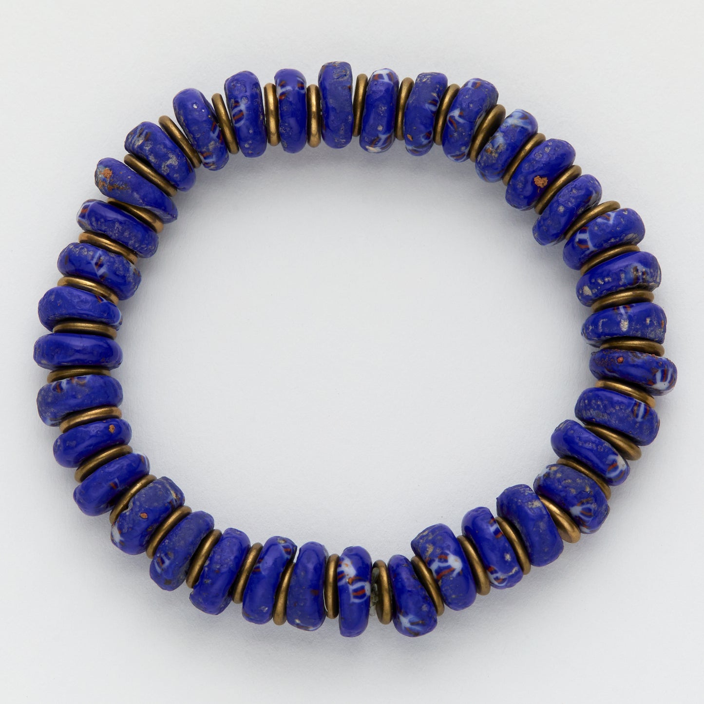 Blue beaded bracelet with gold accents on a white background