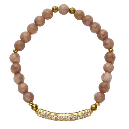 Bracelet with pink beads and gold accents on a white background