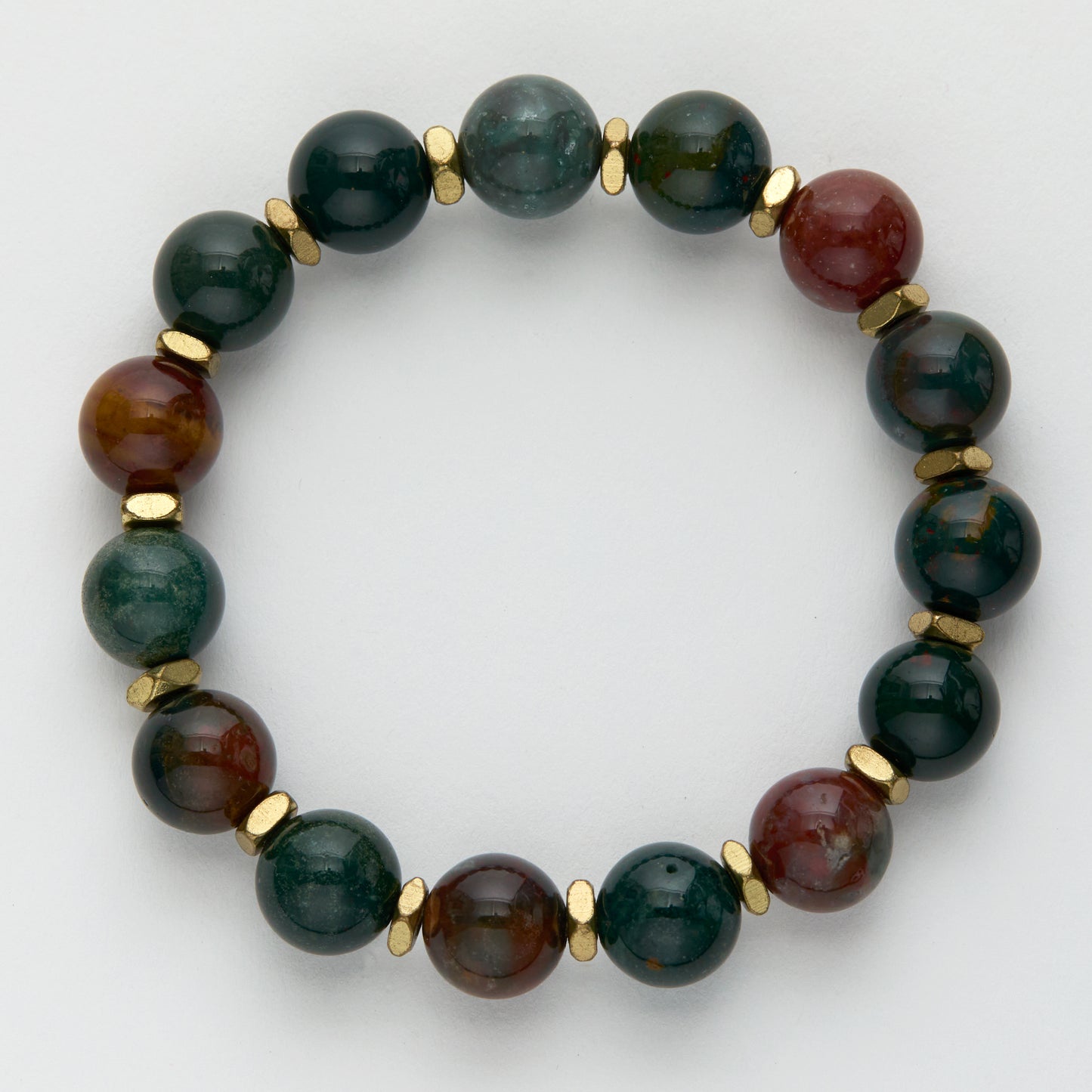 Beaded bracelet with green and brown stones on a white background