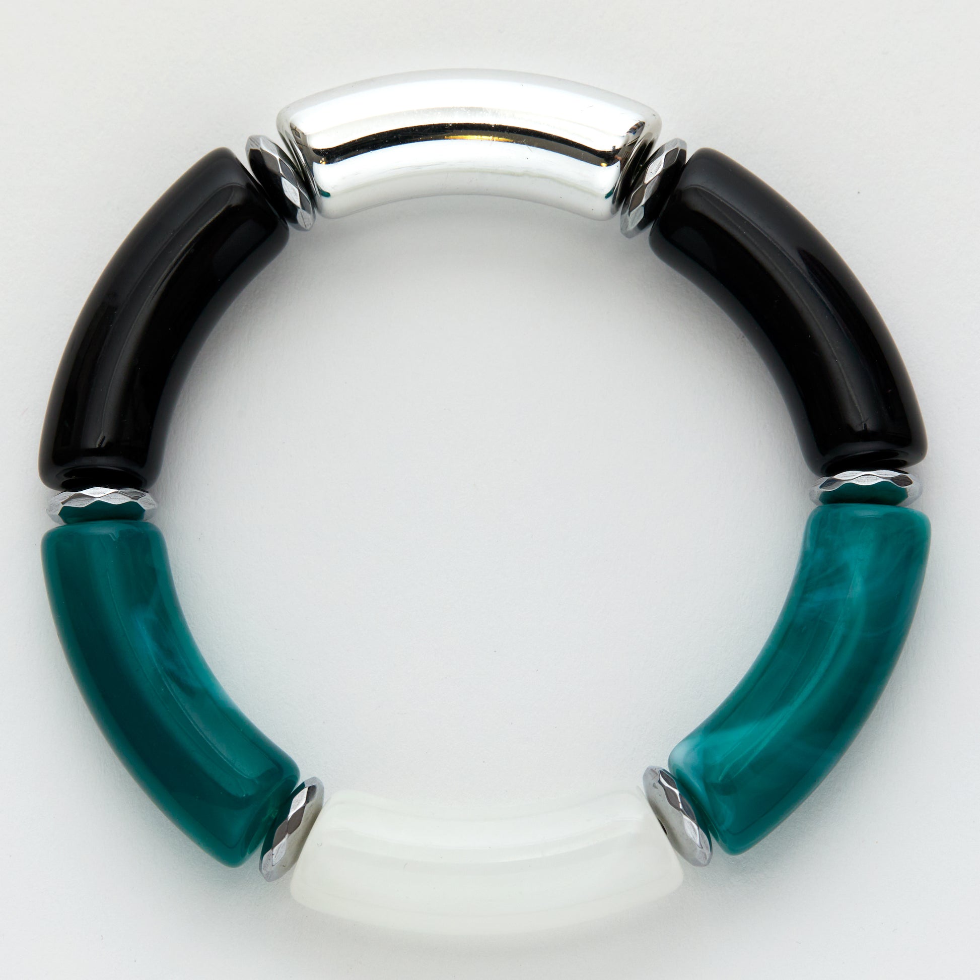 Bracelet with black and teal cylindrical beads on a white background