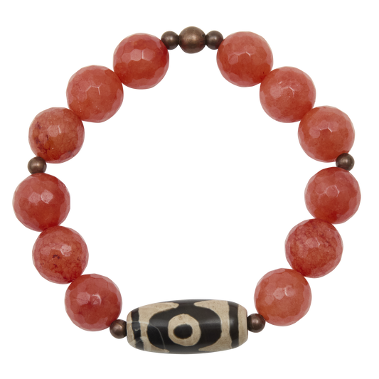 Bracelet with red beads and a brown and white central bead on a white background
