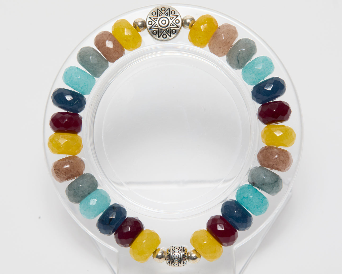 Multicolored beaded bracelet with a silver clasp on a white background