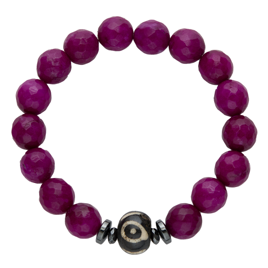 Purple beaded bracelet with a decorative black and silver bead on a white background