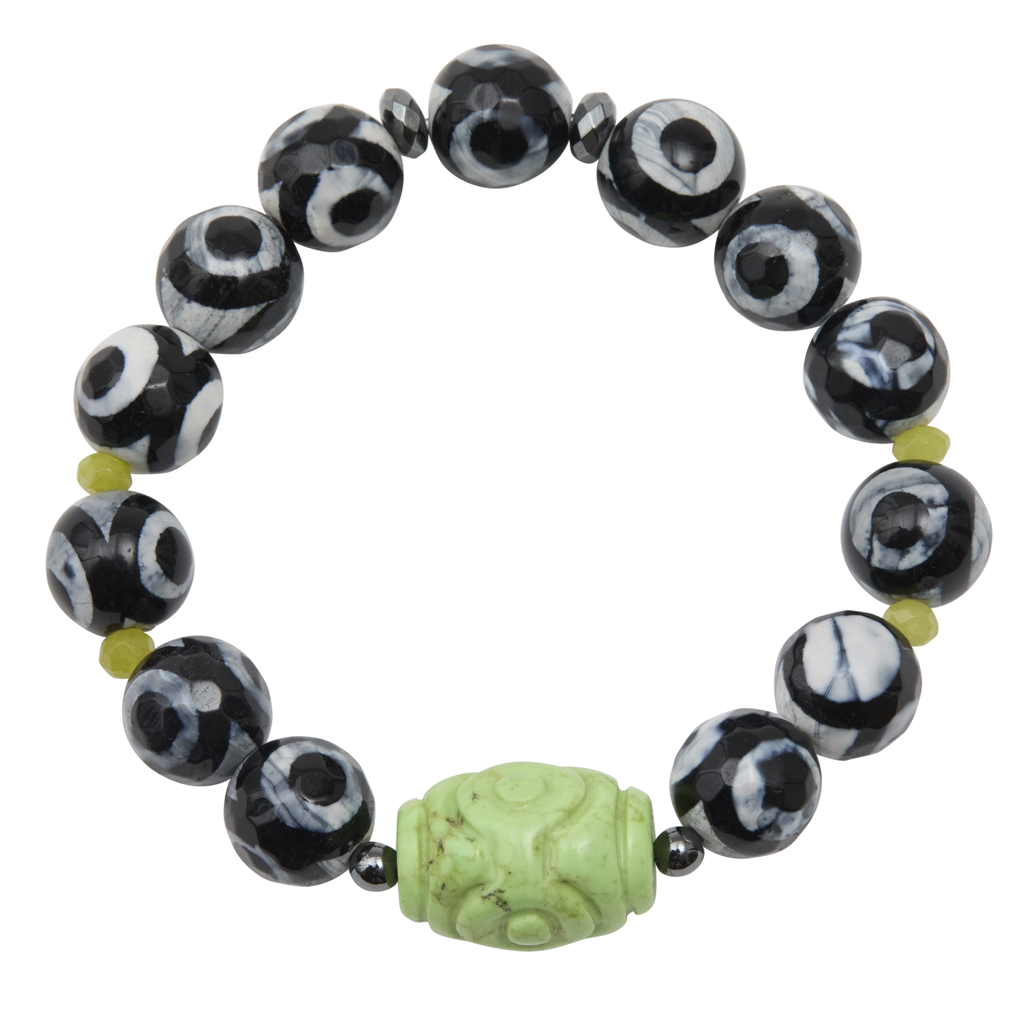 Black and white beaded bracelet with a green carved bead on a white background